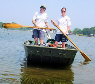 Katia (left) sampling SAV in Shallow Creek near Baltimore with Becky Thur (right).