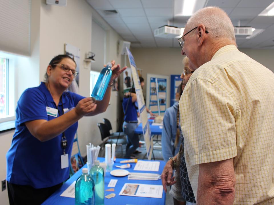 Carys Mitchelmore talks to visit visitor at CBL Open House