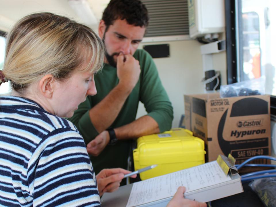 Helen Bailey works with a student on the Rachel Carson. 