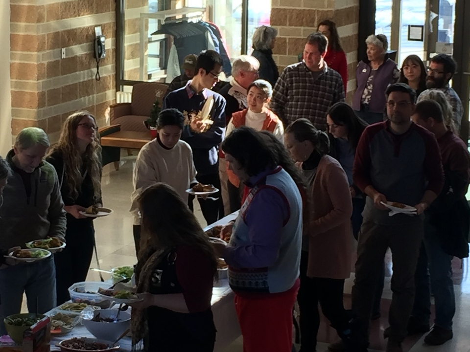 AL faculty, staff and students in buffet line in December 2019 