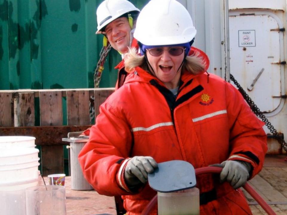 Jackie Grebmeier looks at a sample while Lee Cooper poses for the camera.