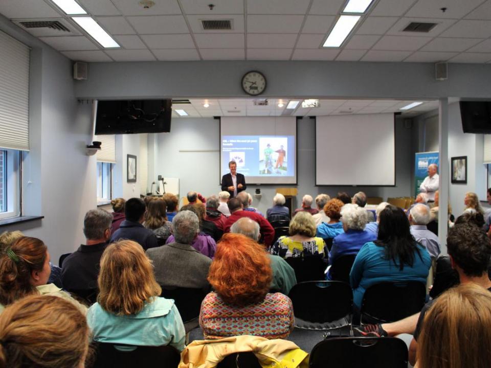 Group of citizens listening to a lecture