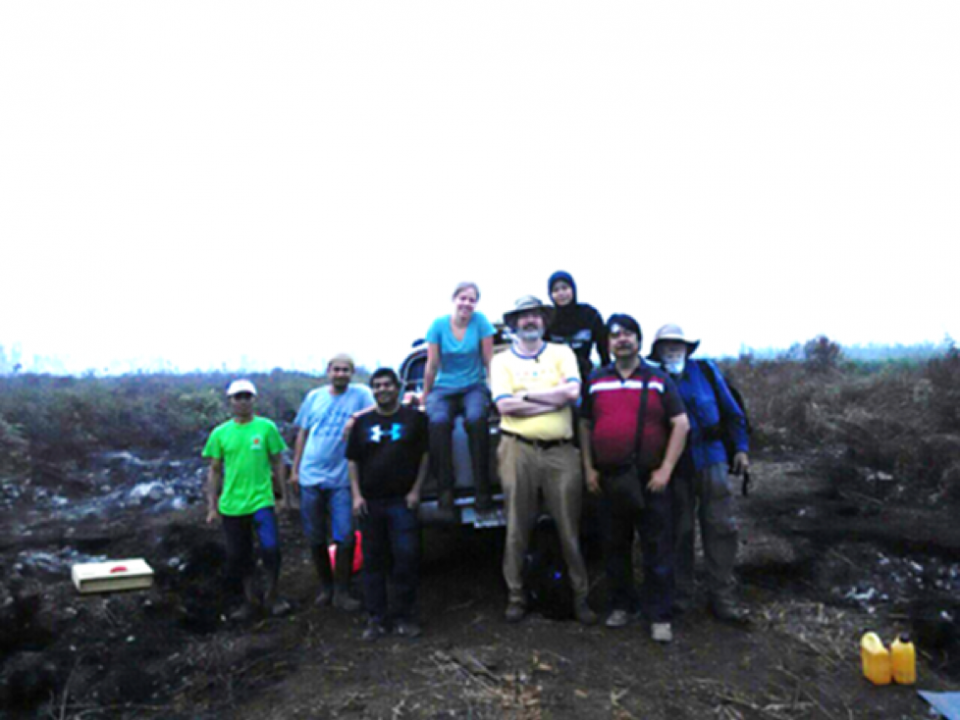 Mark Cochrane poses with his research team during field work. 