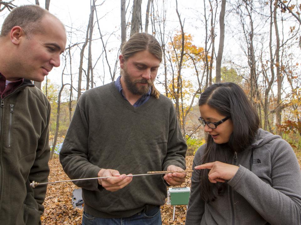 David Nelson and Andrew Elmore teach a student. 