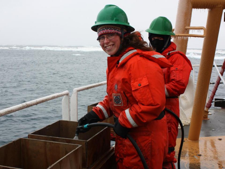 Christina Goethel hoses down benthic samples she needs for her master's research.