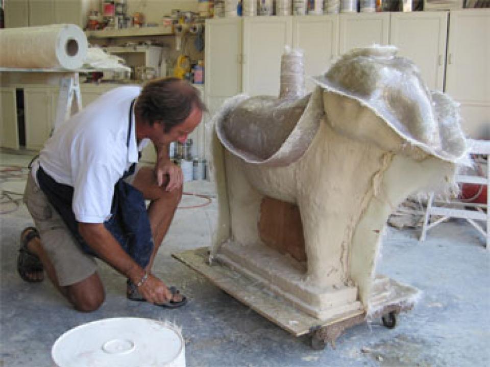 Easton craftsman John Schroeder and the concrete pour of a new ram in its fiberglass case.
