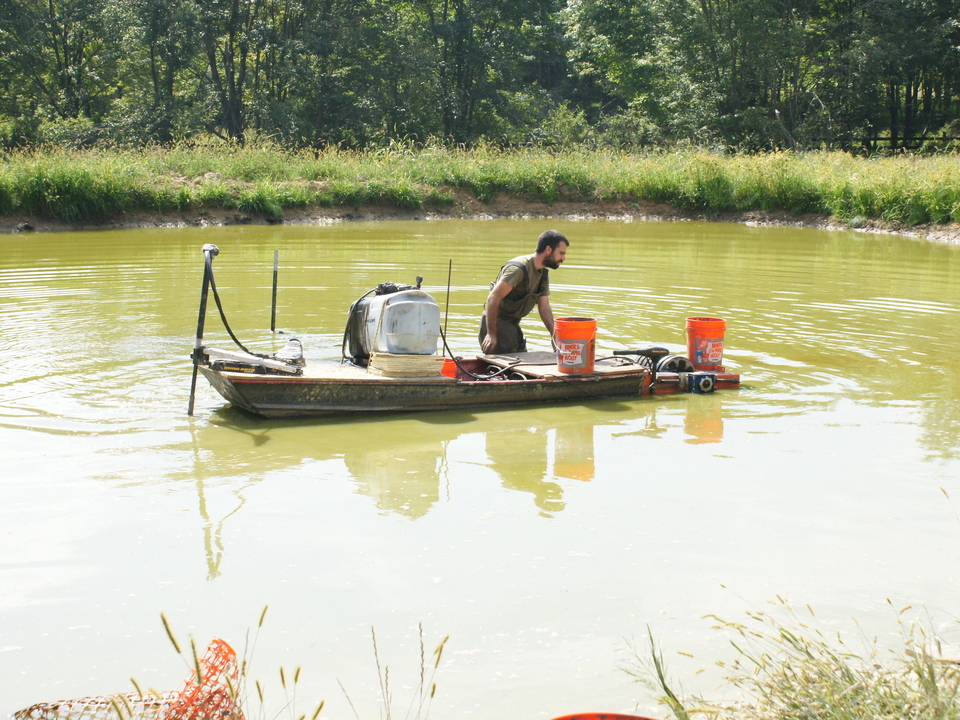 Ryan Powell In the in an algae surrounded boat