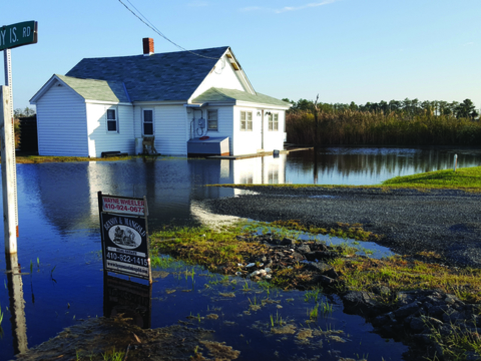 A house in Dorchester County is surrounded by water