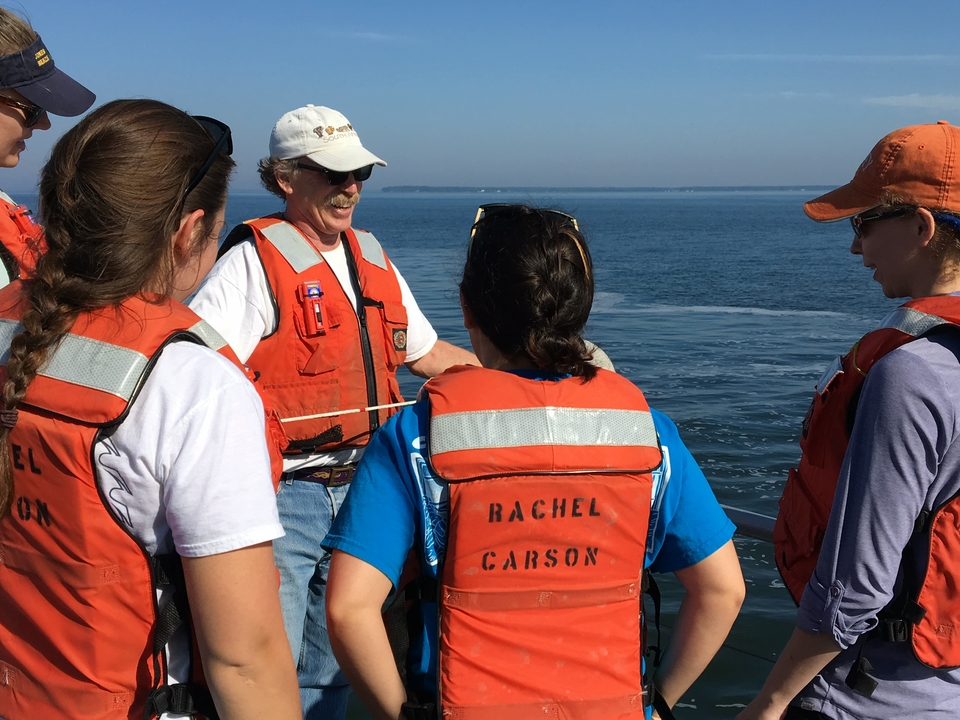 Professor Raleigh Hood talks to one group about measuring water quality.