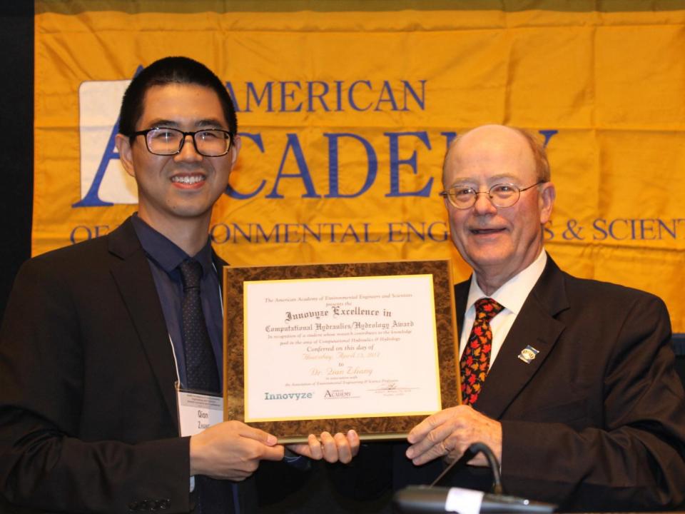 Qian Zhang receives his Innovyze Excellence in Computational Hydraulics/Hydrology Award from Howard B. LaFever, past board president of the American Academy of Environment Engineers and Scientists