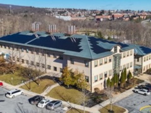 Aerial photo of UMCES Appalachian Laboratory with solar panels installed on roof. Frostburg State Campus can be seen in the background. 