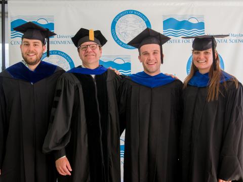 David Secor poses with the graduates who earned degrees for fisheries studies. 