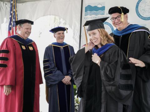 Melanie Jackson is hooded by her mentor Jeff Cornwell at UMCES 2019 Commencement