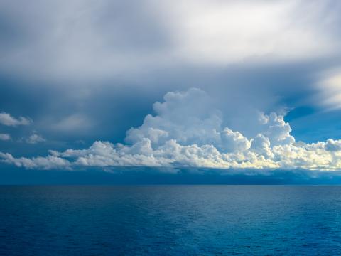 Deep blue Atlantic Ocean with clouds