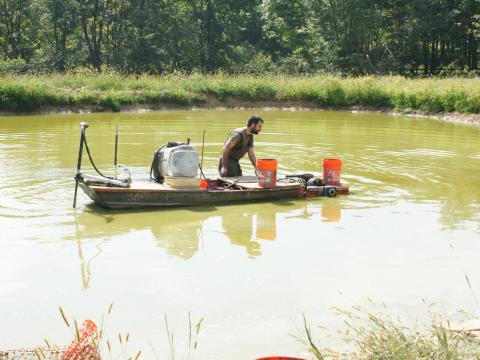 Ryan Powell on boat doing research on algal biofuel