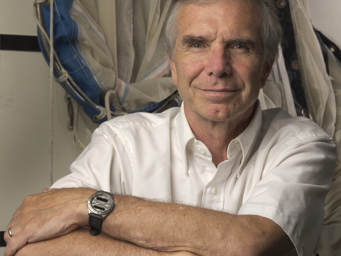 Mike Roman, sitting in front of research gear