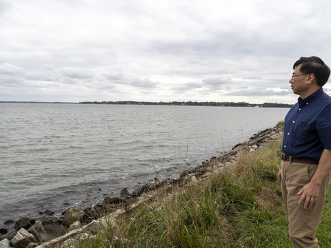 Ming Li outside the Horn Point Laboratory looking out at the Chesapeake Bay