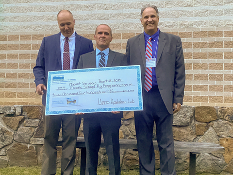 Dr. David Nelson, UMCES Appalachian Laboratory Director; Matthew Kline, 2025 Richard Johnson Environmental Education Award winner; and Dr. Fernando Miralles-Wilhelm, UMCES President standing in front of stone wall with red brick wall in background 