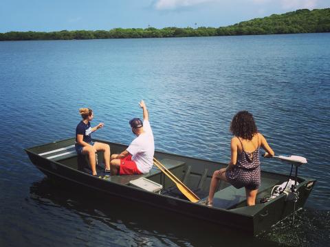 Students on a boat look out to sea