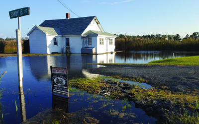 A house in Dorchester County is surrounded by water