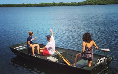 Students on a boat look out to sea