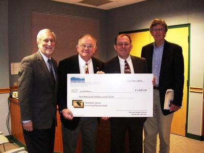 Photo of Tom Mathews receiving the 2014 Johnson Award with  UMCES President Donald Boesch, Appalachian Laboratory Director Raymond Morgan, Johnson Award winner Tom Mathews, and nature writer Tom Horton.