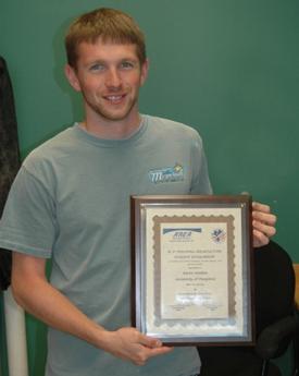 IMET's Aaron Watson earns an award.