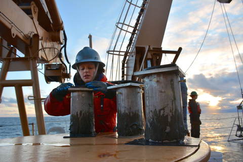 Chelsea Wegner with scientific equipment aboard an arctic research vessel