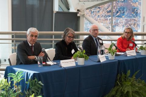 Four EU Ambassadors sit at a panel at IMET