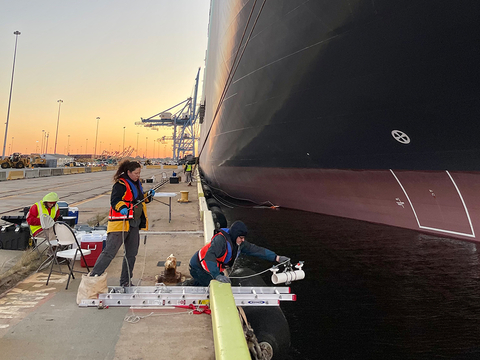 Tamburri next to boat in harbor