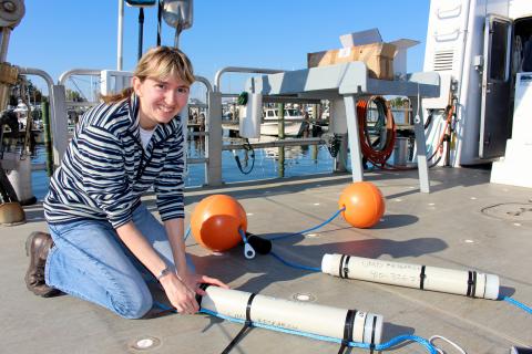 Helen Bailey with acoustic monitoring equipment