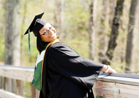 Image of Andrea White in graduation regalia