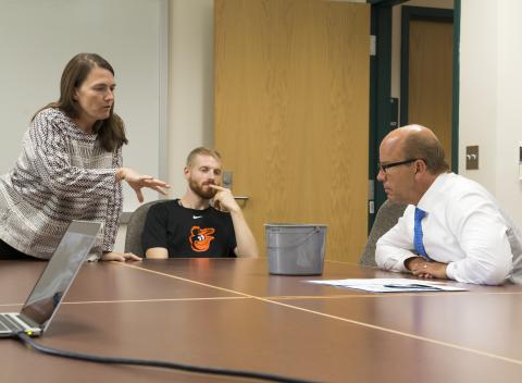 Photo of Katia Engelhardt discussing Vallisneria restoration and ecology with Representative John Delaney 