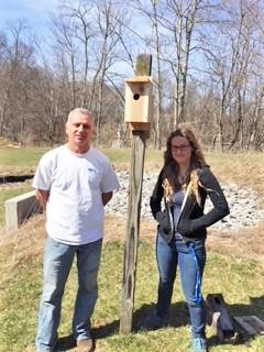 John Piasecki, AL Facility Manager, and Claire Nemes, Ph.D. student, with installed bluebird box. 