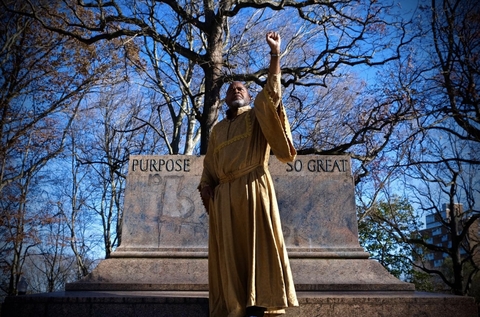 Image of actor Keith Snipes outside in front of a monument