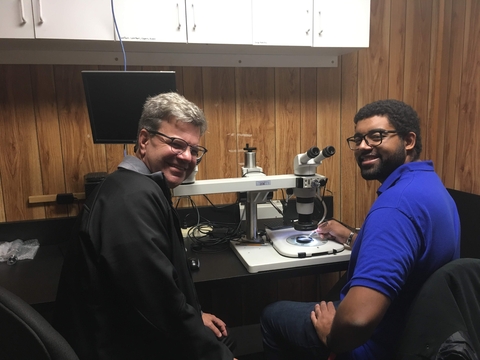 Ben Frey and Dave Secor in their Lab, in front of a microscope