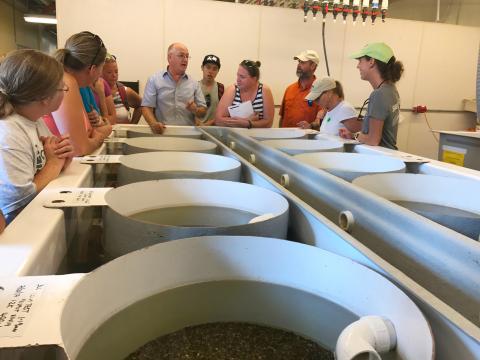 Dr. Tom Miler speaks to science teachers about aquaculture during a Group Tour