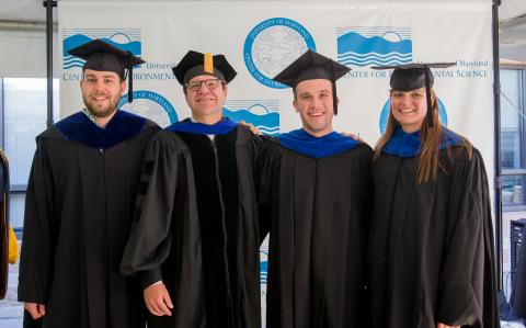 David Secor poses with the graduates who earned degrees for fisheries studies. 