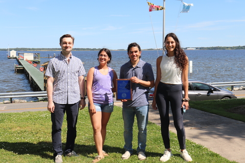 Jeremy Testa with his students holding his award