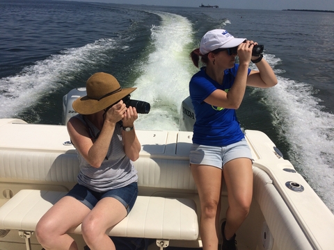 Amber Fandel and Jamie Testa searching for dolphins on the Chesapeake Bay