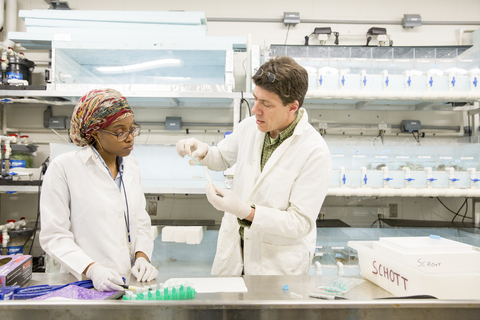 Eric Schott and student in the lab