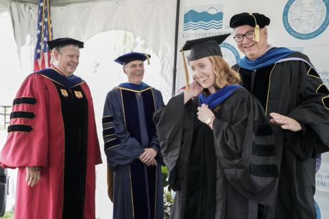 Melanie Jackson is hooded by her mentor Jeff Cornwell at UMCES 2019 Commencement