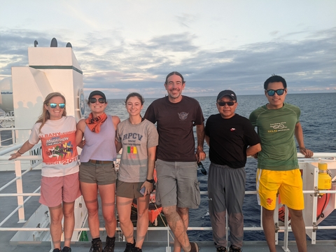 Maddy Lahm stands with the team of UMCES scientists aboard their research vessel in Hawai'i