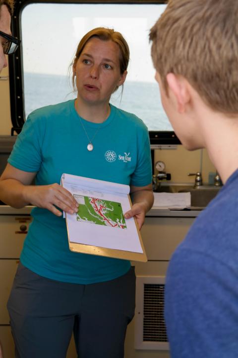 Scientist Laura Lapham talking to students on the Rachel Carson research vessel