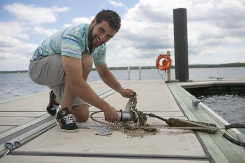 A graduate student prepares equipment to monitor rockfish migration