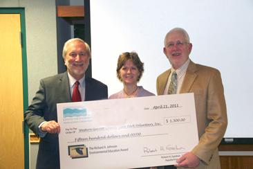 Photo of Dr. Donald Boesch (left) and Dr. Robert Gardner (right) present Caroline Blizzard a check supporting the work of the Western Garrett County State Park Volunteers.