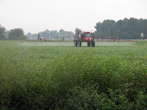 A tractor sprays herbicides on a Maryland farm. 