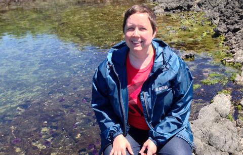 Horn Point Laboratory graduate student Maureen Brooks posing in a tidal pool