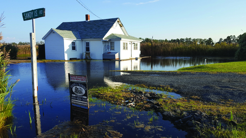 House surrounded by rising waters