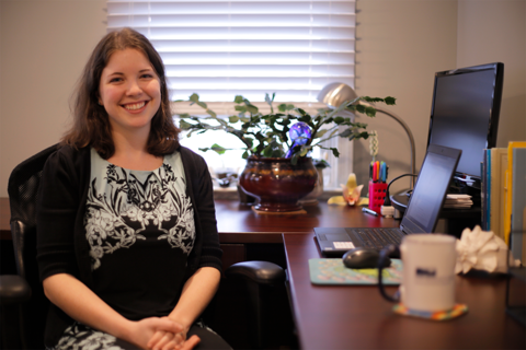 Suzi Spitzer in an office with laptop